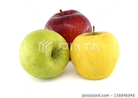 Three ripe apples in different colors: red, green, and yellow, isolated on white 138846948