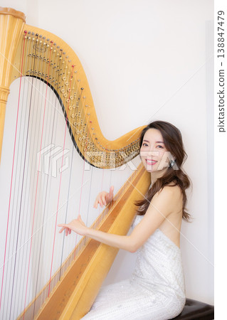 Female harpist Female harpist 138847479