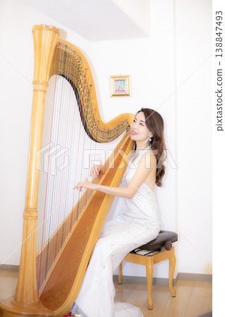 Female harpist Female harpist 138847493