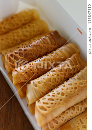 Stack of pancake roll filled with assorted filling. 138847510