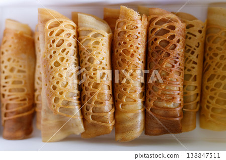 Stack of pancake roll filled with assorted filling. 138847511
