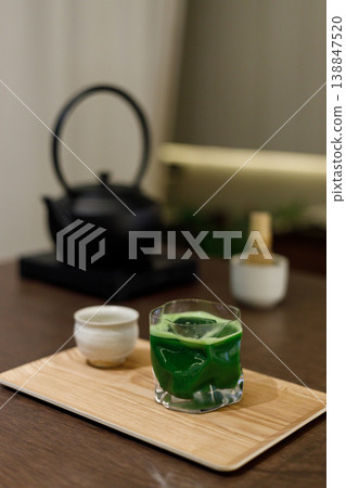 Cup of fresh matcha tea, green tea and Chasen, bamboo whisk, on wooden table. 138847520