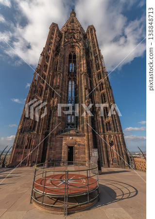 Visit to Strasbourg Cathedral with view of clock platform in broad daylight with blue sky Visit to Strasbourg Cathedral with view of clock platform in broad daylight with blue sky 138848713