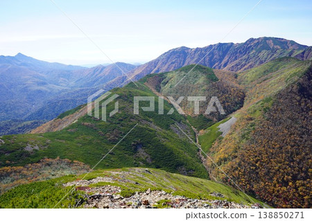 The ridgeline viewed from Mt. Uni-Ishikari in the eastern Daisetsuzan Mountains in autumn. The ridgeline viewed from Mt. Uni-Ishikari in the eastern Daisetsuzan Mountains in autumn. 138850271