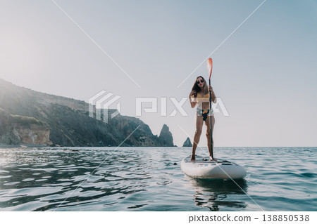 Woman Paddleboarding Ocean Coastline Summer Woman Paddleboarding Ocean Coastline Summer 138850538