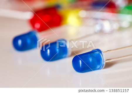 Blue LED diodes close-up on white background with shallow depth of field Blue LED diodes close-up on white background with shallow depth of field 138851157