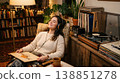 A woman relaxing while listening to her favorite records. 138851278