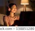A woman relaxing while listening to her favorite records. 138851280