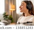 A woman relaxing while listening to her favorite records. 138851283