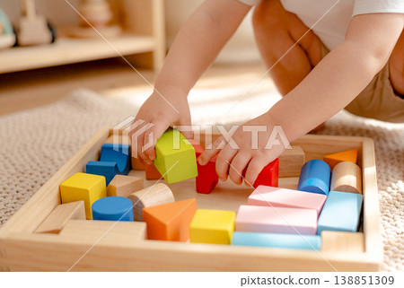 Children playing with building blocks Children playing with building blocks 138851309