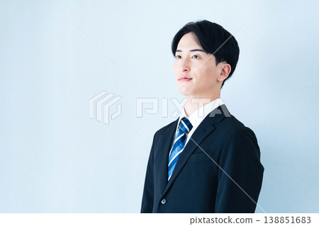 young man wearing a suit young man wearing a suit 138851683