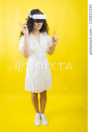 Woman interacting with future virtual reality technology 138852595