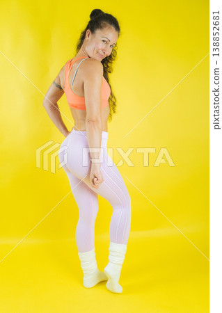 Fit woman posing, showing strong glutes and healthy lifestyle Fit woman posing, showing strong glutes and healthy lifestyle 138852681