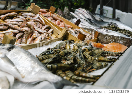 Fresh Shrimp and Fish Displayed on Ice at Seafood Market Fresh Shrimp and Fish Displayed on Ice at Seafood Market 138853279