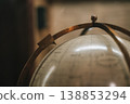 Vintage globe with meridian ring close-up, antique geographic instrument detail 138853294