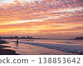 Shonan Tsujido Beach: The sunrise over the autumn sky and the silhouettes of surfers. 138853642