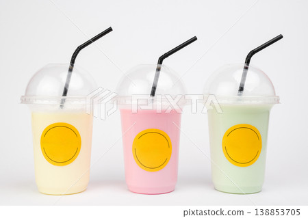 Colorful refreshing fruit drinks in clear cups with cheerful branding showcasing the joy of summer treats at a lively outdoor gathering Colorful refreshing fruit drinks in clear cups with cheerful branding showcasing the joy of summer treats at a lively outdoor gathering 138853705