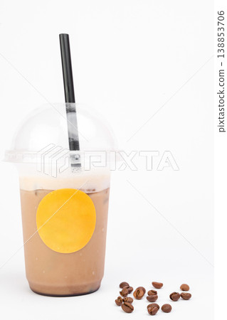 Refreshing blend of coffee and milk served in a clear cup, showcasing the drinks creamy texture and inviting appearance 138853706