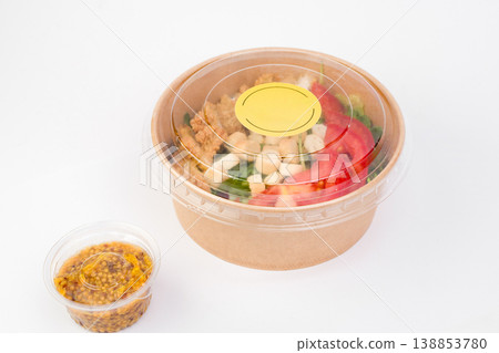 Savor a delightful bowl brimming with fresh, flavorful ingredients ideal for a quick and satisfying lunch in a lively urban environment Savor a delightful bowl brimming with fresh, flavorful ingredients ideal for a quick and satisfying lunch in a lively urban environment 138853780