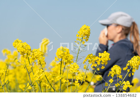 woman suffering from pollen allergy while  training outdoors 138854682