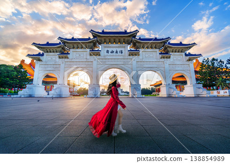 Asian woman walking in Archway of Chiang Kai Shek Memorial Hall in Taipei, Taiwan. Translation: "Liberty Square". 138854989