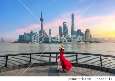 Tourists sightseeing on The Bund and Lujiazui of Shanghai, China. Tourists sightseeing on The Bund and Lujiazui of Shanghai, China. 138855015