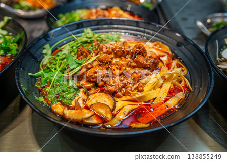 Local food and snacks including pork, Scallion Oil Noodles, intestines and seafood brochettes displayed in a popular market at night, Shanghai, China. Local food and snacks including pork, Scallion Oil Noodles, intestines and seafood brochettes displayed in a popular market at night, Shanghai, China. 138855249