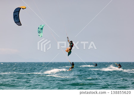 Nha Trang, Khanh Hoa, Vietnam - April 5, 2026: Multiple Kitesurfers Performing Big Air Jumps Over Sea Nha Trang, Khanh Hoa, Vietnam - April 5, 2026: Multiple Kitesurfers Performing Big Air Jumps Over Sea 138855620