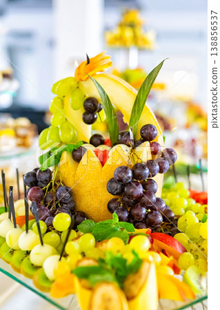 Sweet table with fruit, biscuits and chocolates.. Wedding catering. Candy and fruit bar on party. Restaurant table 138856537