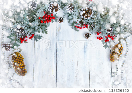Christmas wooden background with snow branch. Top view with copy space for your text Christmas wooden background with snow branch. Top view with copy space for your text 138856560