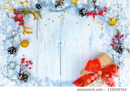 Christmas wooden background with snow branch. Top view with copy space for your text Christmas wooden background with snow branch. Top view with copy space for your text 138856562