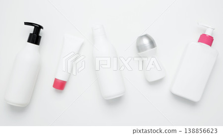 Cosmetic and skincare products including bottles and tubes arranged for branding mockup, highlighting beauty and self-care concept Cosmetic and skincare products including bottles and tubes arranged for branding mockup, highlighting beauty and self-care concept 138856623