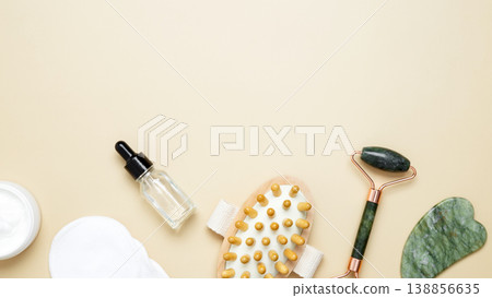 Natural beauty care skincare set featuring marble roller, gua sha, wooden body brush, facial cream and serum Natural beauty care skincare set featuring marble roller, gua sha, wooden body brush, facial cream and serum 138856635
