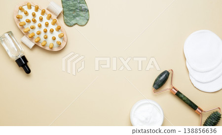 Natural beauty care set featuring facial cream, serum, marble roller, gua sha, and wooden body brush Natural beauty care set featuring facial cream, serum, marble roller, gua sha, and wooden body brush 138856636