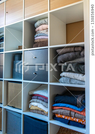Spring cleaning wardrobe organization with eco-friendly decluttering. 138856940