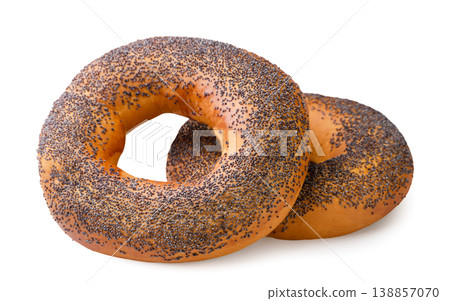 Two bagels with poppy seeds on a white background. Isolated Two bagels with poppy seeds on a white background. Isolated 138857070