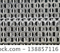 Texture of a metal grate showing circular holes arranged in a repeating pattern with a smooth surface 138857116
