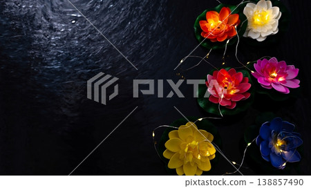 Vesak lantern lotus flowers floating on dark water, Buddha birthday celebration background Vesak lantern lotus flowers floating on dark water, Buddha birthday celebration background 138857490