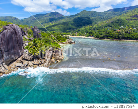 Granite rocks and coral reef in a tropical island Granite rocks and coral reef in a tropical island 138857584