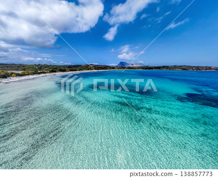 Aerial view of Lu Impostu beach turquoise water in springtime 138857773