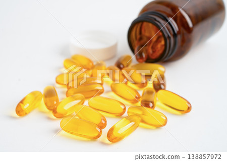 Fish oil or Cod liver oil gel in capsules with omega 3 vitamins, supplementary healthy food. 138857972