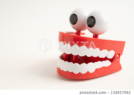 Funny red teeth with eye toy denture model for dental health care. Funny red teeth with eye toy denture model for dental health care. 138857981