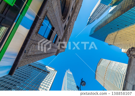 Skyscrapers in Midtown Manhattan under a clear sky Skyscrapers in Midtown Manhattan under a clear sky 138858107