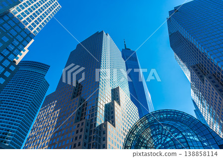 Modern skyscrapers under a bluesky in Lower Manhttan Modern skyscrapers under a bluesky in Lower Manhttan 138858114