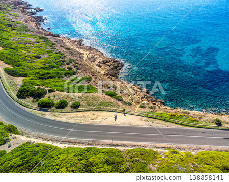 Aerial view of a road by the sea in Sardinia 138858141