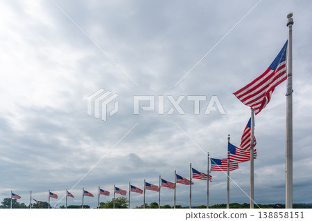 US flags in National Mall under an overcast sky 138858151
