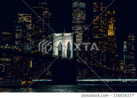 World famous Brooklyn bridge with Manhattan on the background at night World famous Brooklyn bridge with Manhattan on the background at night 138858377