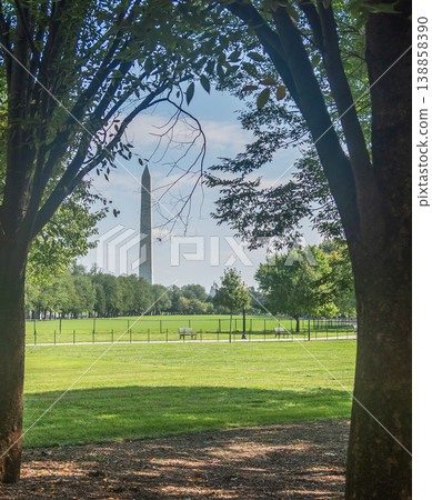 World famous Washington Monument in National Mall seen through the trees 138858390