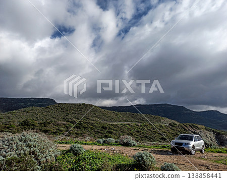 Dramatic sky over a 4x4 car Dramatic sky over a 4x4 car 138858441