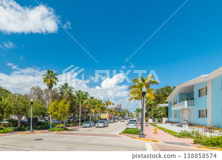 Miami Beach street under a blue sky with white clouds Miami Beach street under a blue sky with white clouds 138858574